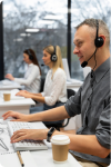  Image of a group of three people wearing headphones and talking with the customers